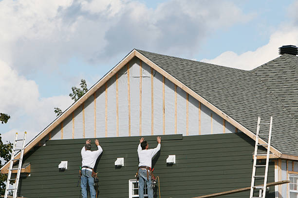 Professional Siding Installation technician working in Bayport, NY